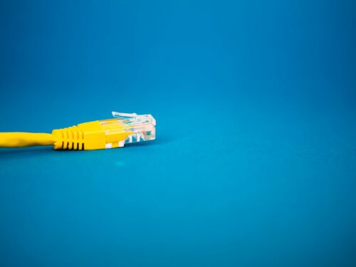 a yellow ethernet cable on a blue background