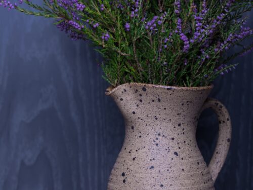 lavender flower in beige pitcher vase