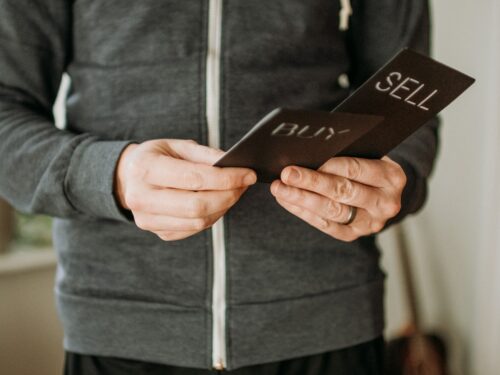 a person holding a cell phone in their hands