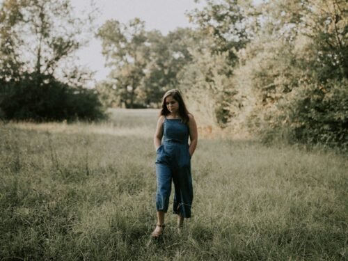 woman standing on grass field