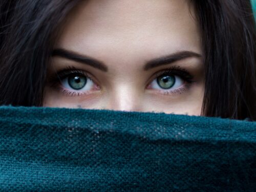 a close up of a person with blue eyes