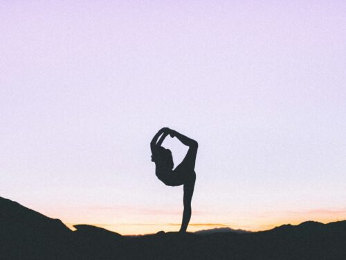 woman standing with her one leg