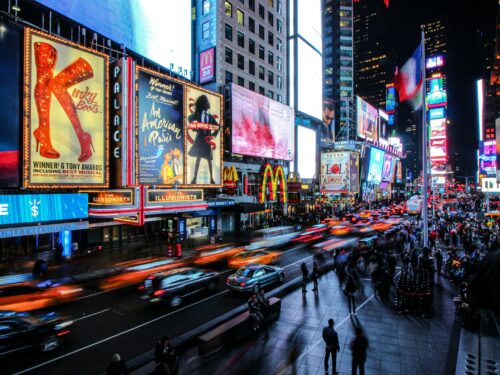 people walking on street during night time