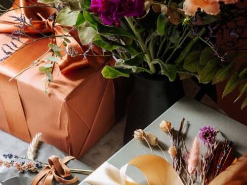 pink and yellow flowers on brown paper bag