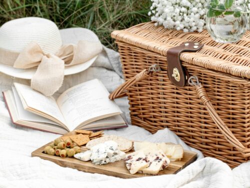 white and brown wicker basket with white textile