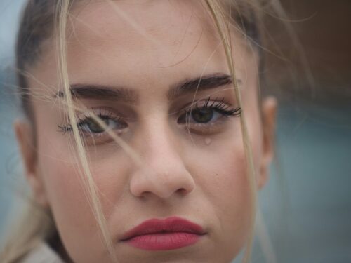 a close up of a person with long hair