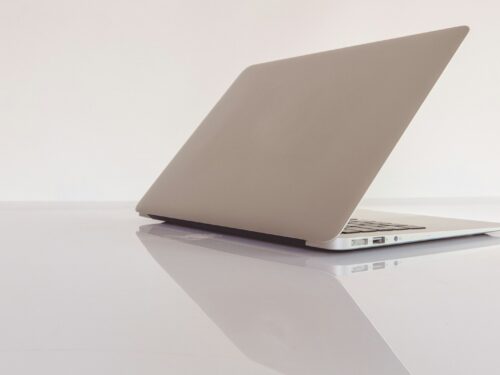 macbook air on white table