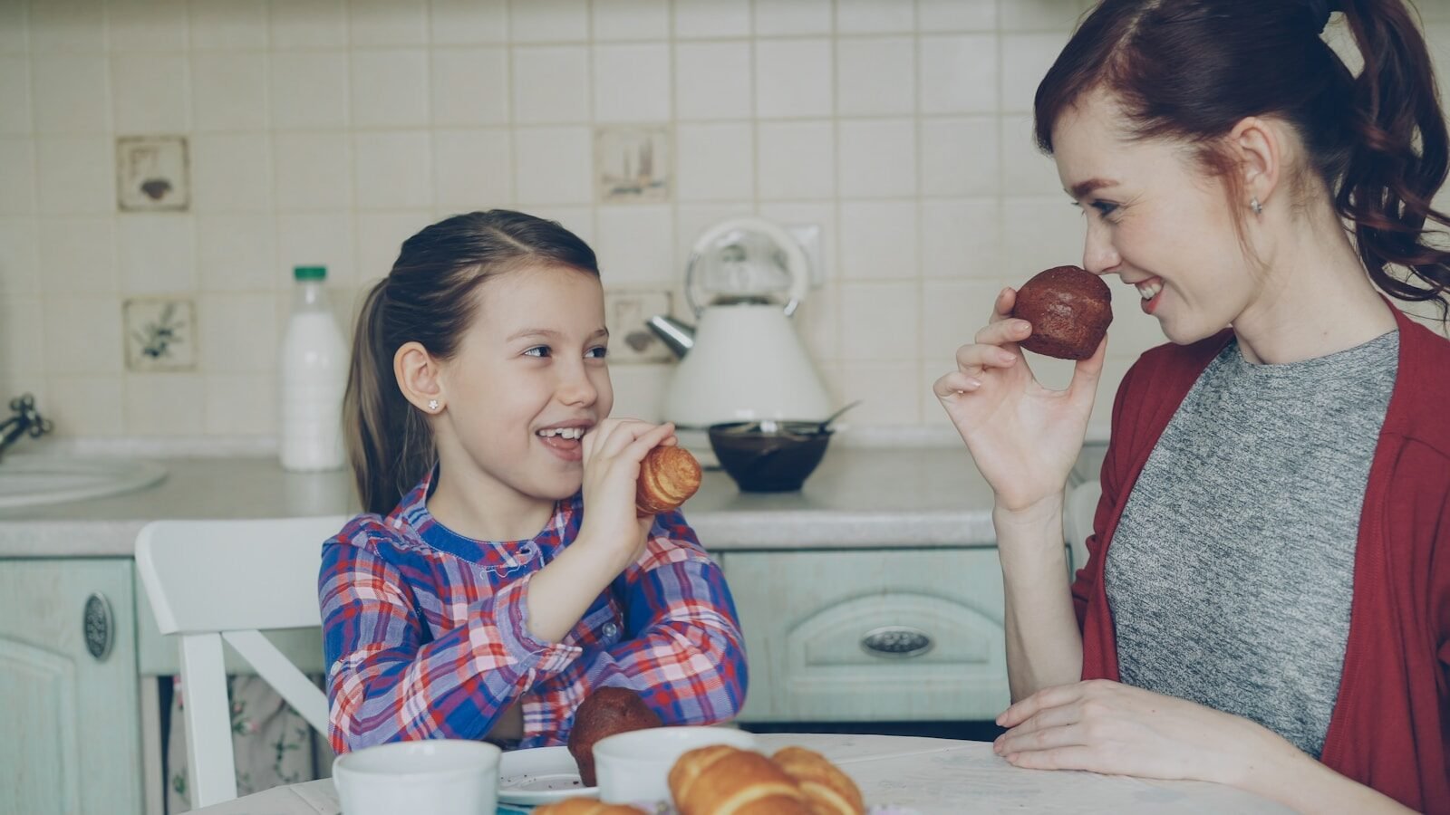 Mother and daughter enjoy breakfast together