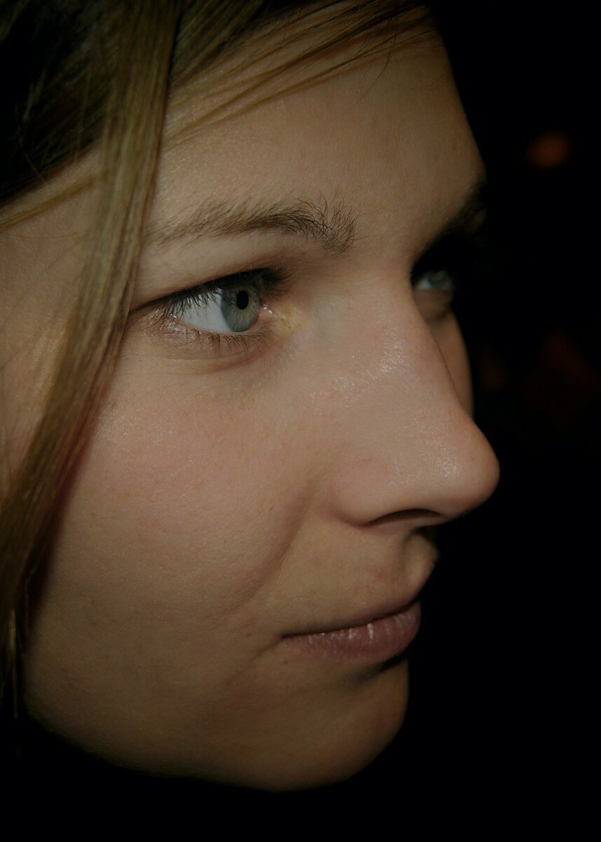 A close up of a person with blue eyes