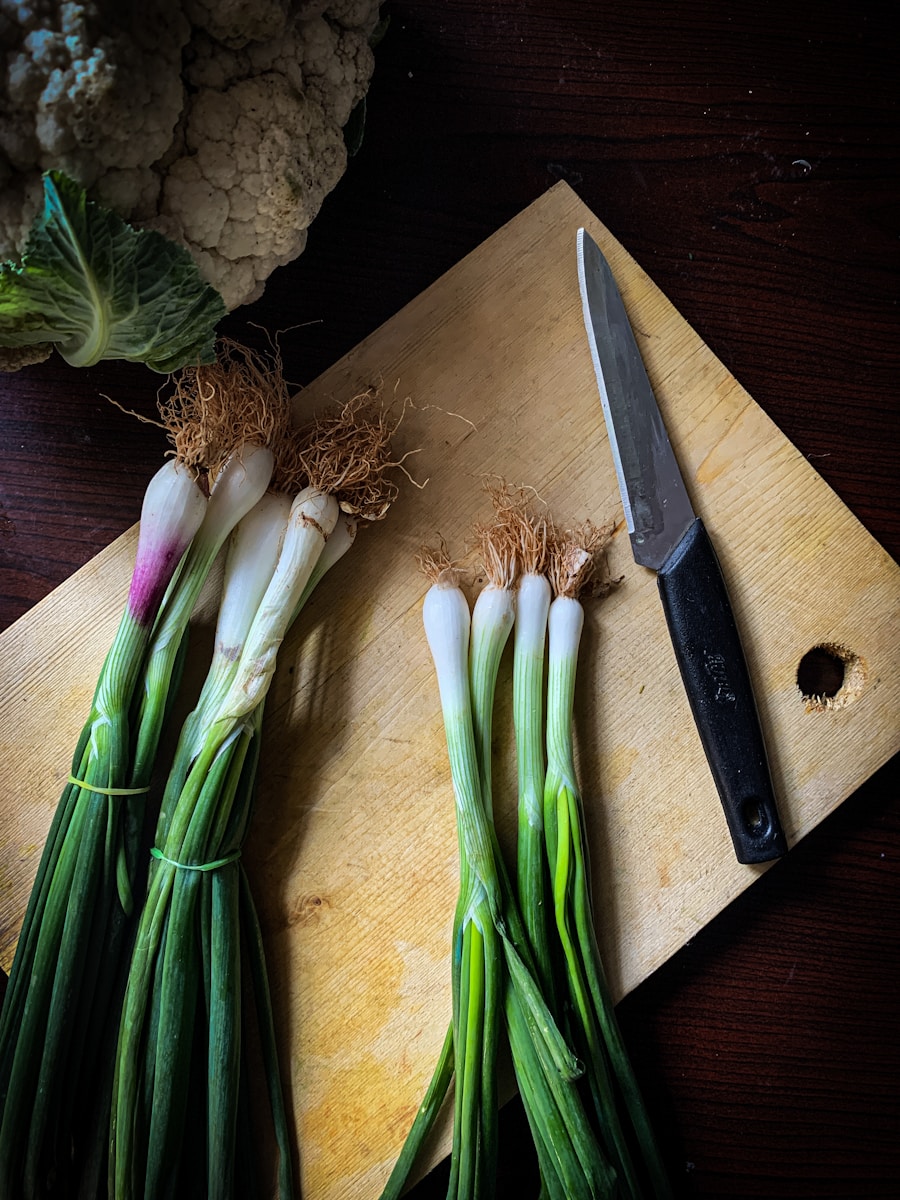 green and white vegetables on brown wooden chopping board