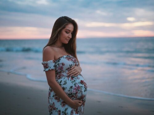 pregnant woman in seashore