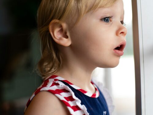 girl in blue and white tank top