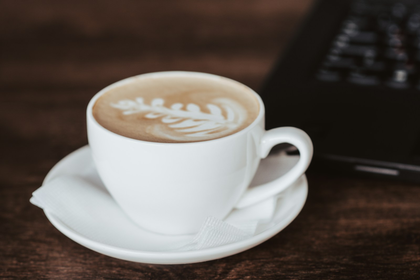 a cup of coffee sitting on top of a saucer