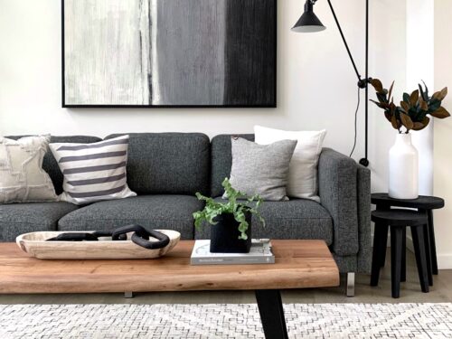 black and white throw pillows on gray couch