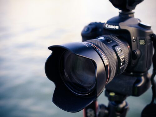 shallow focus photography of black Canon DSLR camera