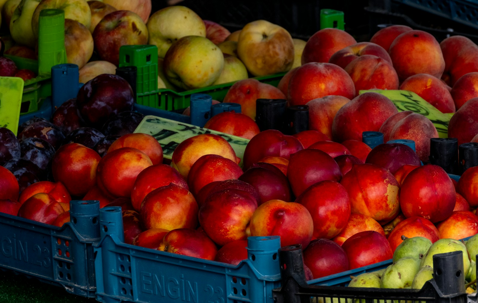 a pile of fruit sitting on top of crates