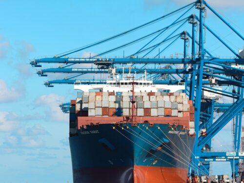 a large cargo ship at a dock