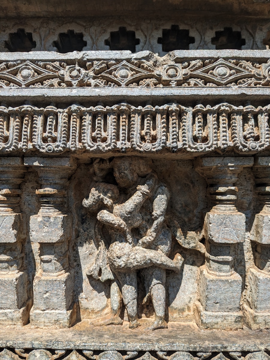 a carving of a man and a woman on a wall