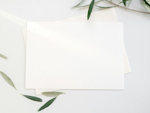 white printer paper with green leaves