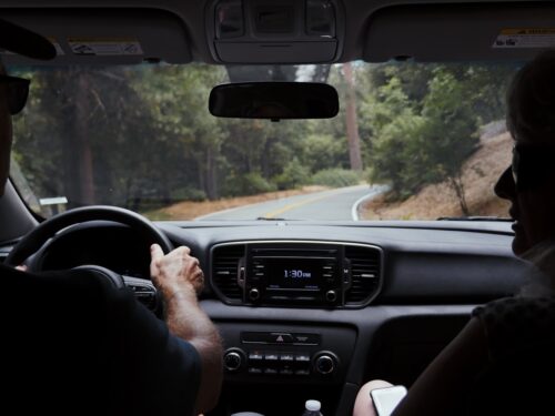 man driving car