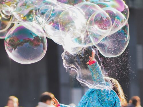 woman blowing bubbles