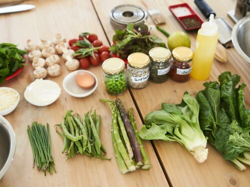 green vegetable on brown wooden table