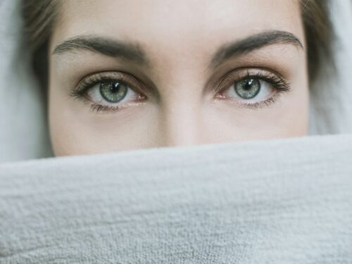 woman covered with white textile