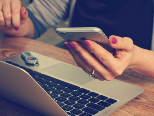 woman holding silver iPhone 6