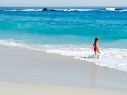 woman running towards shore