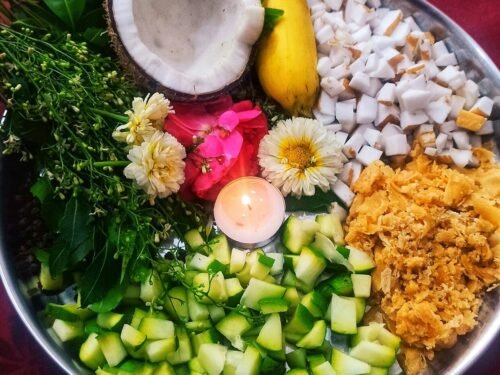 A pooja thali with various auspicious items.