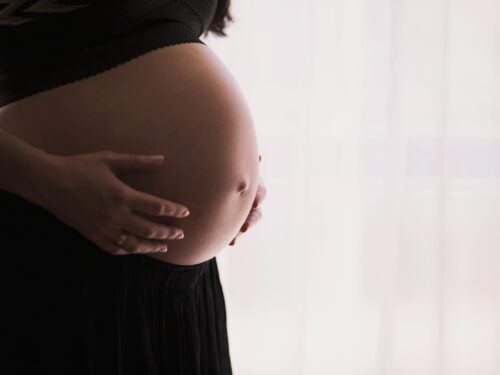 woman holding stomach