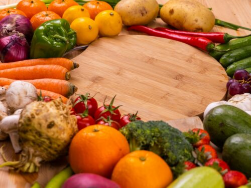 orange and green vegetables on brown wooden table