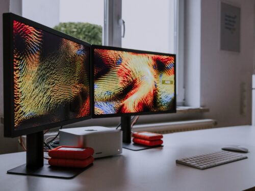 a computer monitor sitting on top of a desk