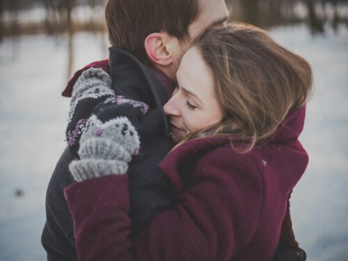 man and woman hugging each other