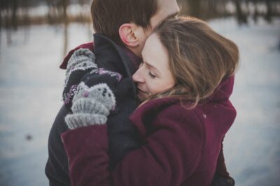 man and woman hugging each other